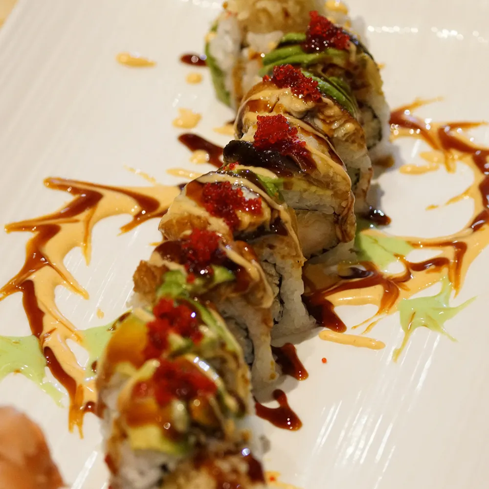 Avocado eel sushi roll drizzled with sauces and roe at Miso, a Japanese Restaurant in New Haven