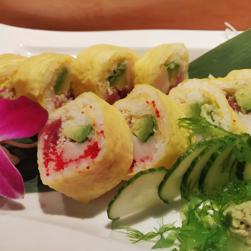 Egg wrapped sushi roll with avocado and fish filling at Miso, a Japanese Restaurant in New Haven