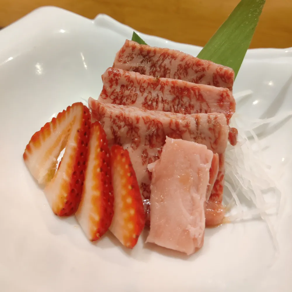 Seared wagyu sashimi served with sliced strawberry at Miso, a Japanese Restaurant in New Haven
