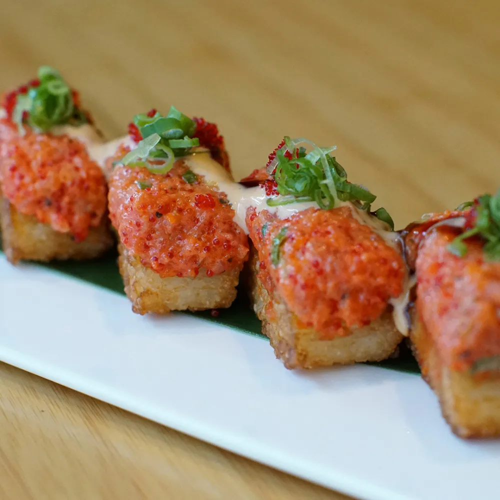 Spicy sushi on crispy base garnished with green onion at Miso, a Japanese Restaurant in New Haven
